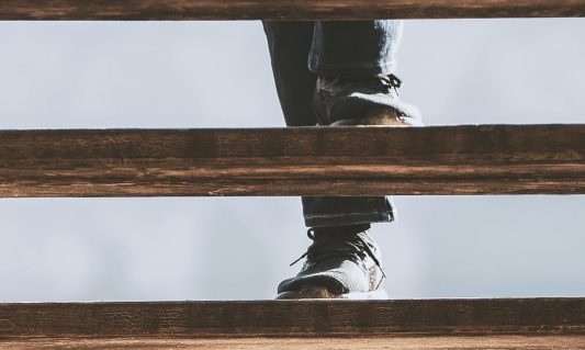 man walking up steps