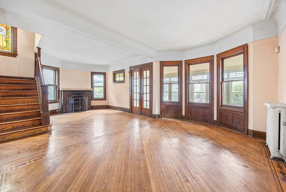 parlor with brick fireplace, stained glass