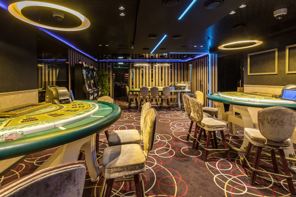 interior of elite luxury vip casino with poker tables