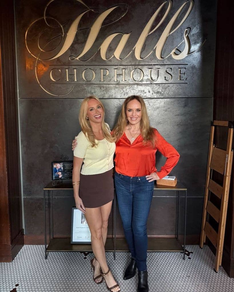 Catherine Bach poses with a friend